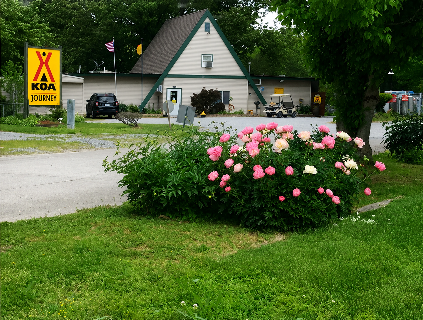 Campground office and KOA Journey sign at Benton KOA in Benton Illinois